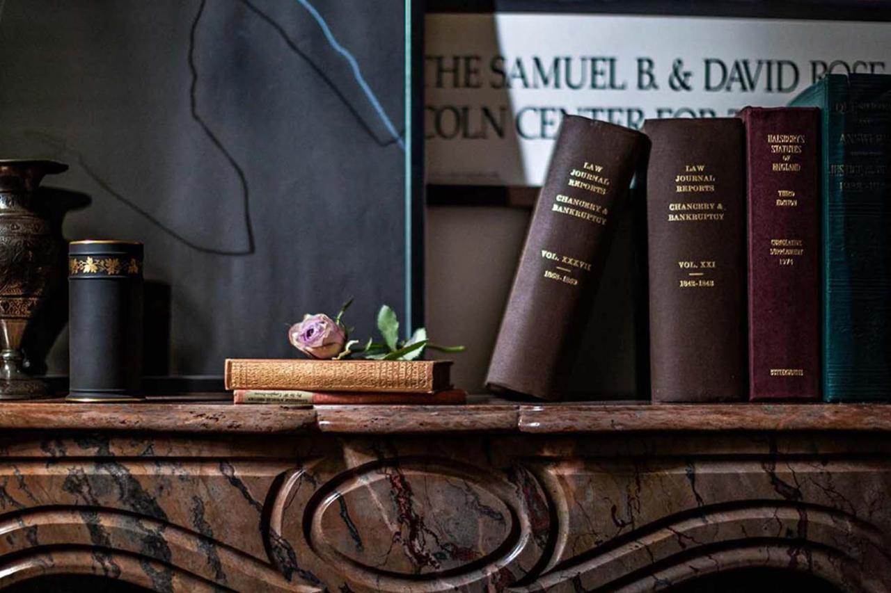 Nomad London Hotel Eksteriør billede Books on a fireplace mantel